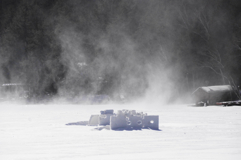 Following the snow was some wind with gusts that exceeded 30 mph. The resulting snow devils that danced on the lake and pummeled the tired bottle rocket war forts made for some impressive drifting on the North end of the lake.