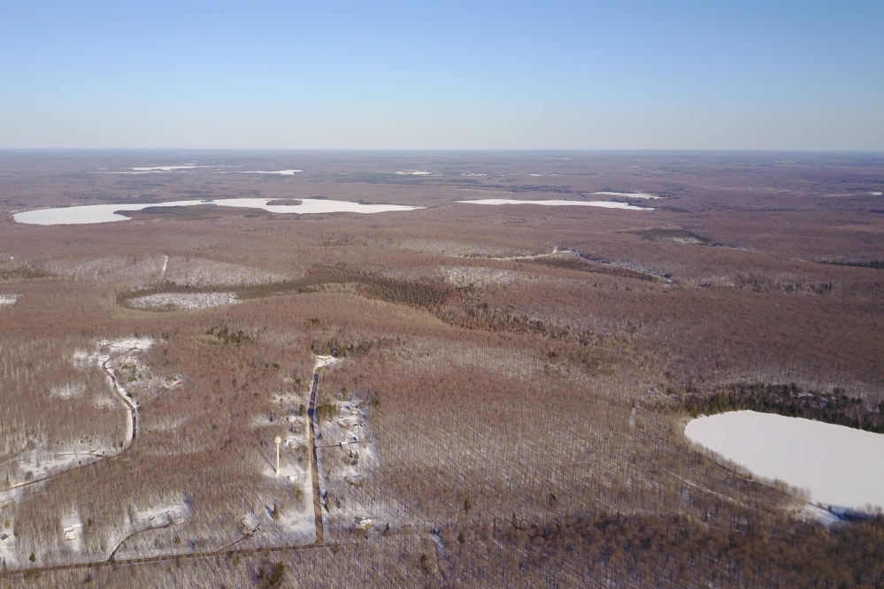 Lakes Wabikon and Riley are both still covered with ice.