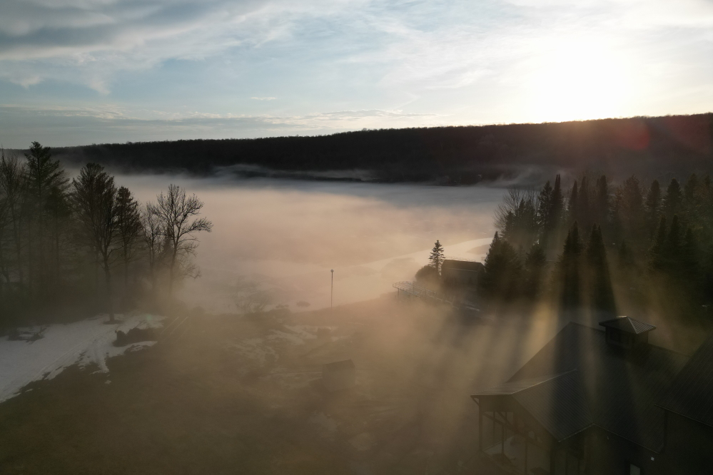 A breeze picked up.  The fog was blown off and piled up on the north shore.