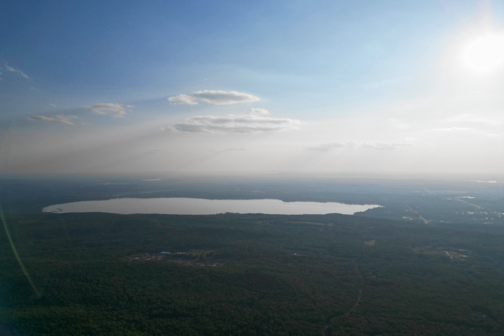 By Tuesday, the wind shifted and the air cleared enough to see Lake Metonga when peeking over the hill to the west.