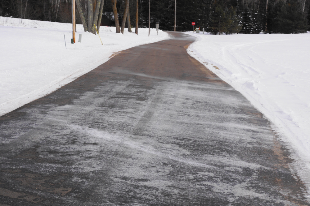 Local roads were cleared of snow in a timely manner, but there were occasional patches of ice bonded to the asphalt.