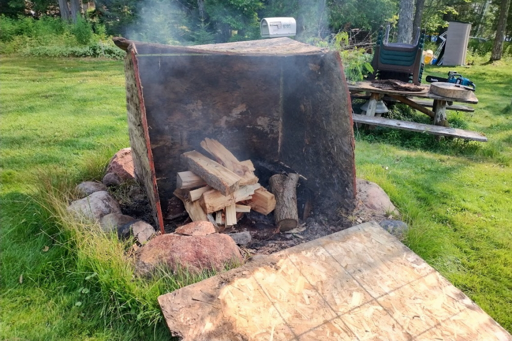 With the early rain last week, we took advantage of a low fire danger to get rid of some old OSB. We have learned that making a little box around a small fire can trap the heat and result in a bigger fire.