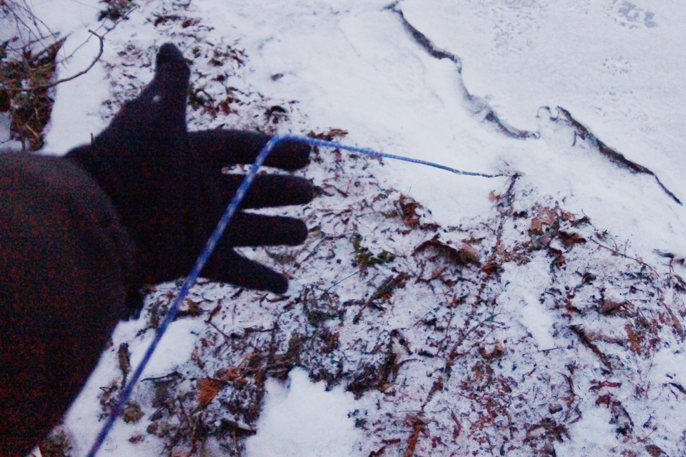 We wanted to get the thermometer out of the lake before the ice covered and damaged it. Much of the cord that connected it to the shore was ice free. We proceeded to gently chip the device free of the ice. 