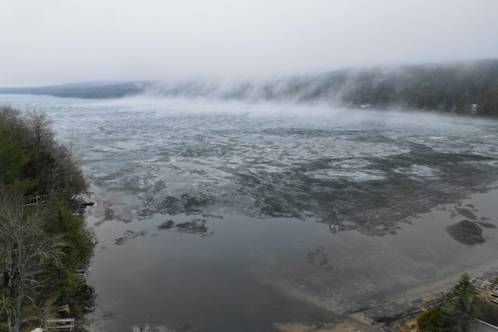 As the weekend approached, it rained. The damp, still air and the ice made piles of fog on the lake. A short time later, a small breeze crashed the fog into the trees.