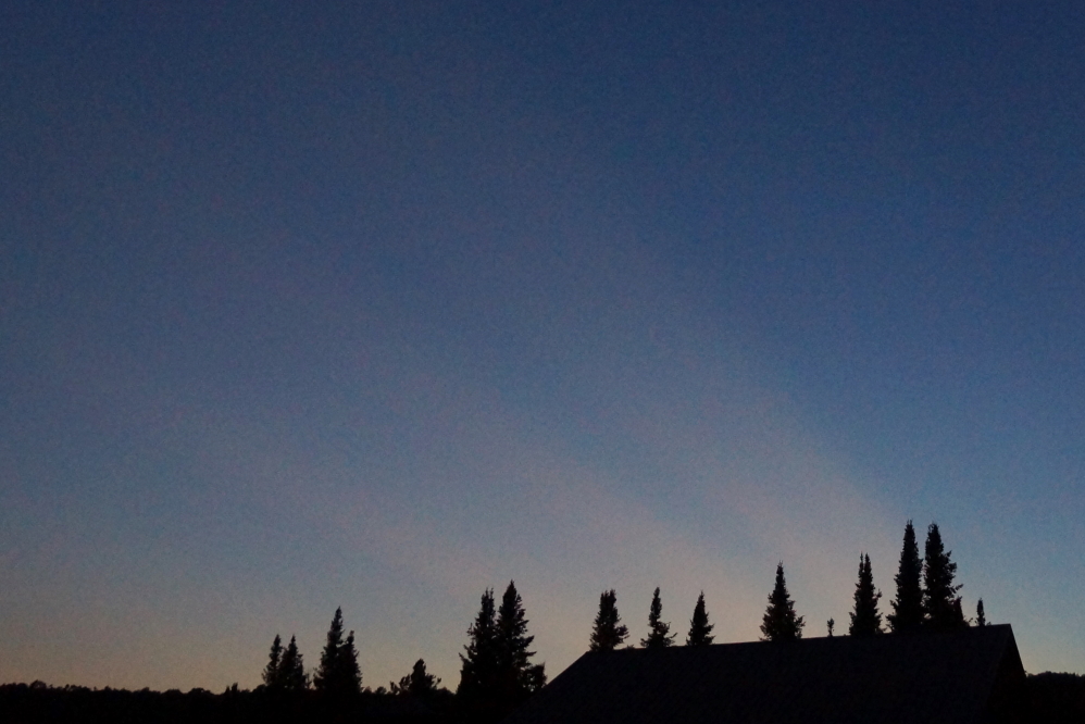 Many sunsets last week were smothered by thick cloud cover, but Sunday's was clear with strange, barely visible streaks of redish light.