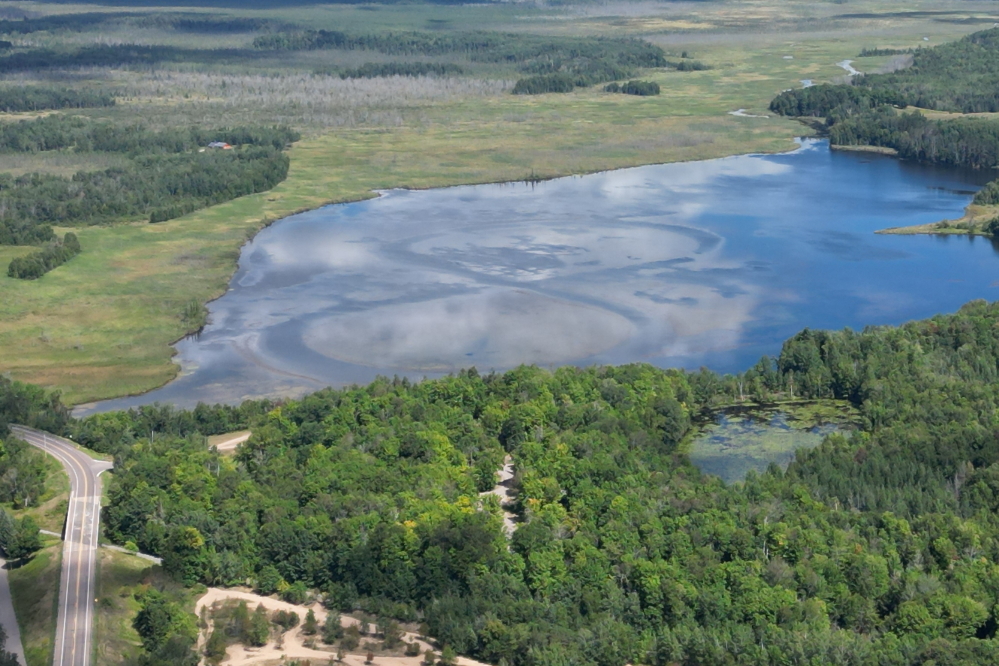 If you were tall enough and looked to the north, you could see the figure eight worn into the weeds of Peshtigo Lake from above the north end of the parade.