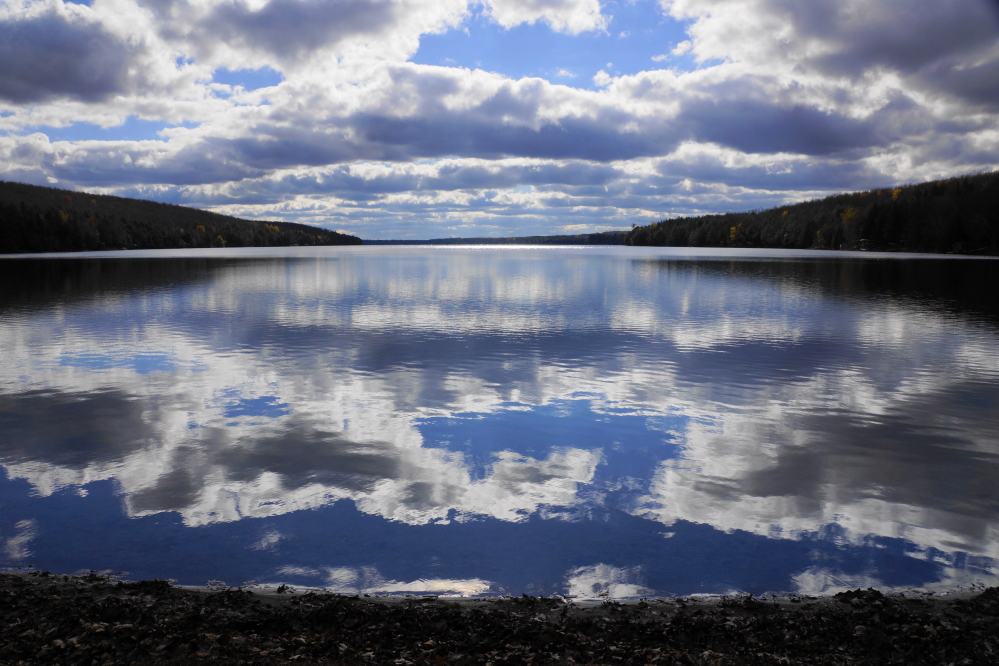 The lake was super flat at the start of the week. If it weren't for the cardiac event cold of the water, one more ski run would have been nice.