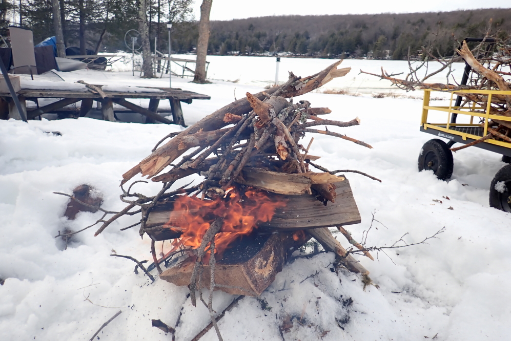 To further celebrate the death of winter, the first campfires were lit to burn collected brush and help clear the firepit of snow.