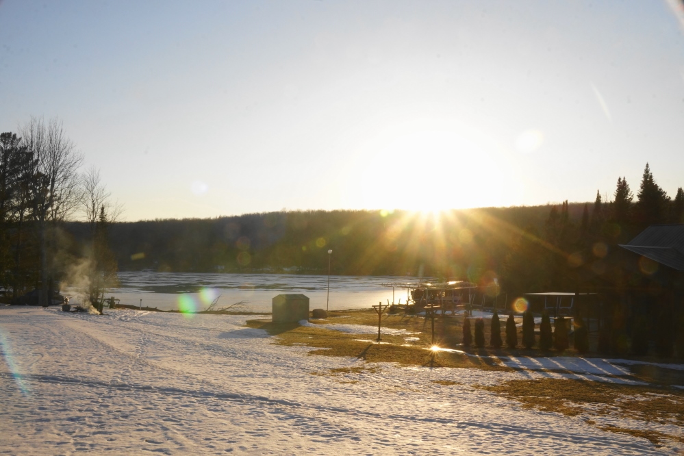 By Sunday's sunset, there was more lawn, less dead ash, and thinner ice on Lucerne.
