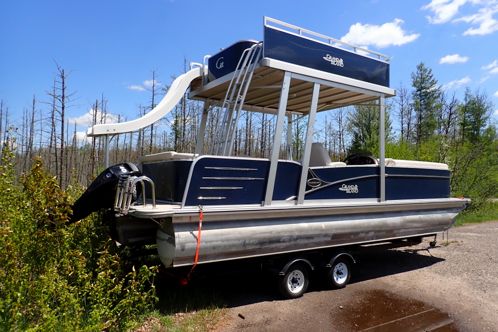On Sunday, one of our favorite pontoon boats was waiting on the edge of the launch for a part, or lift, or something.